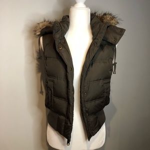 green vest with fur hood